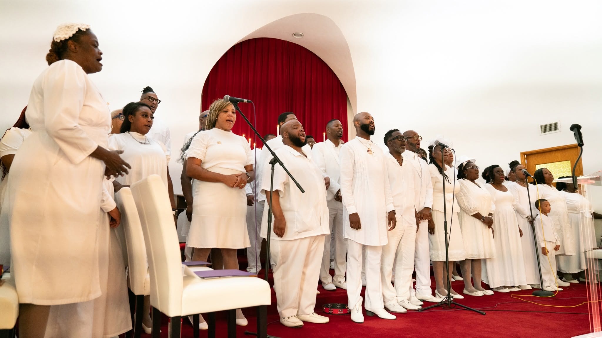 The choir in white — lifting every voice