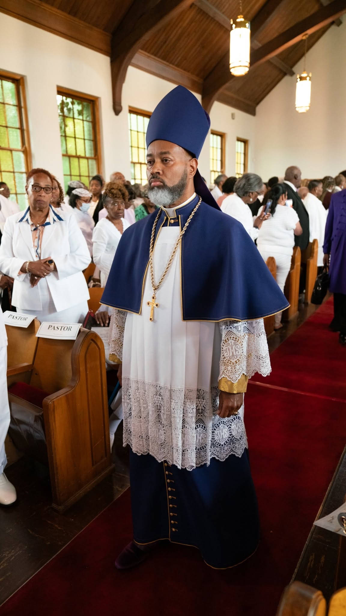 Robed in blue and gold — walking the aisle in full regalia