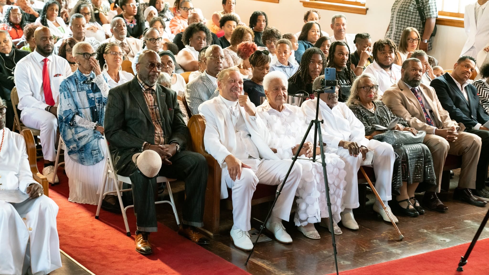 Front row faith — the congregation seated and attentive