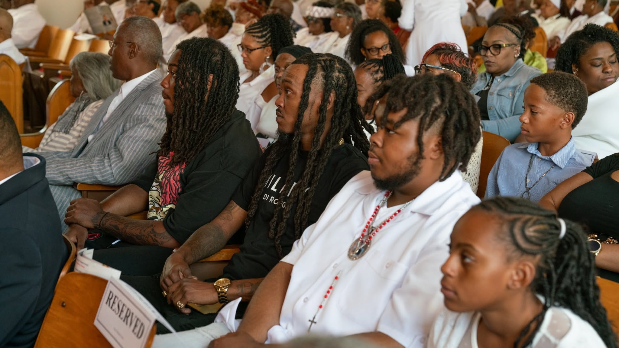 Everybody's welcome — young and old, seated in the pews