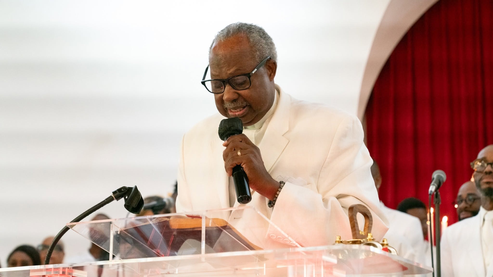 Leaning into the Word — the pastor preaches with power at the pulpit